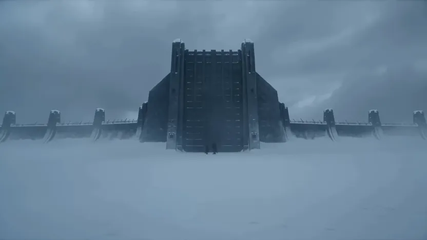 Colossal gate standing in a frozen wasteland